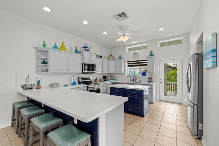 Spacious kitchen with center island and bar seating for 4.