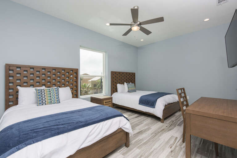 Third floor bedroom with full beds