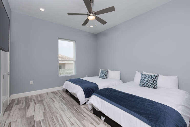 Third floor guest bedroom with two Queens