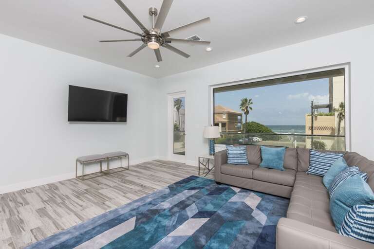 Second floor living area with 65" HD Smart TV