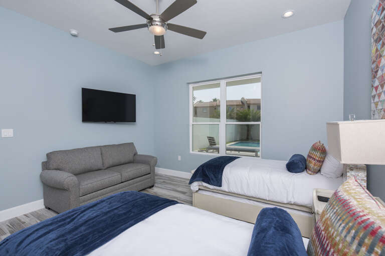 Ground floor guest bedroom with two twins featuring trundle beds