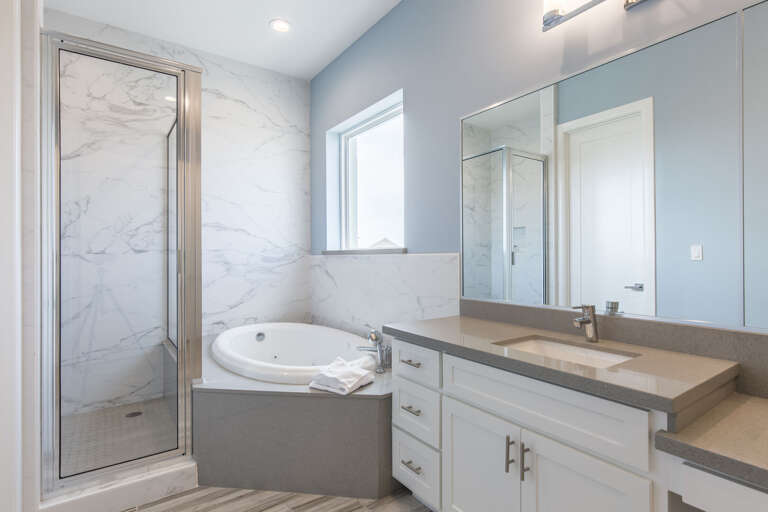 Master bathroom featuring a soaking tub