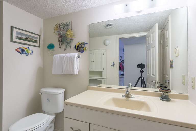 Shared half bathroom and laundry room.