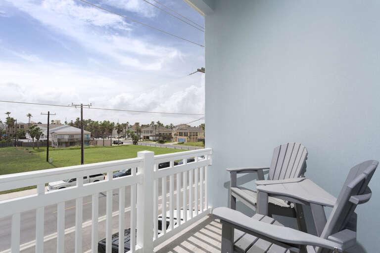 2nd floor guest bedroom with king (street side) balcony