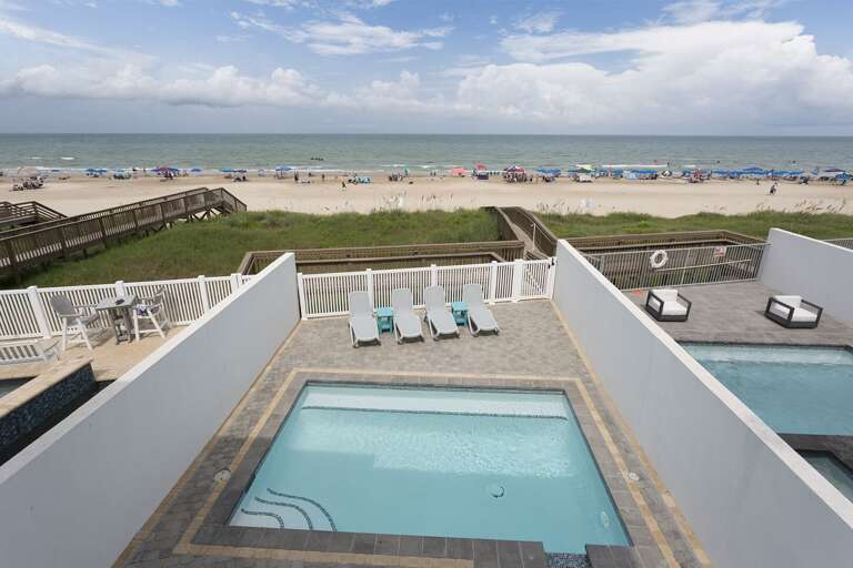 Balcony view facing the pool and beach!