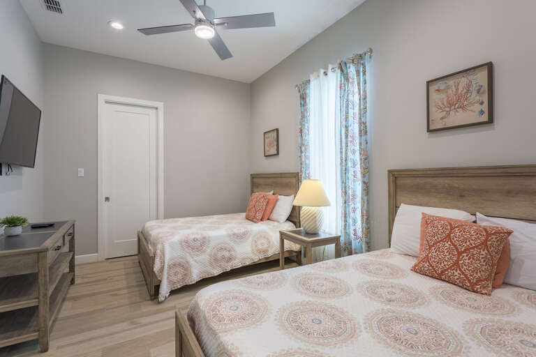 Second floor guest bedroom with full sized beds and a jack & jill styled bathroom.