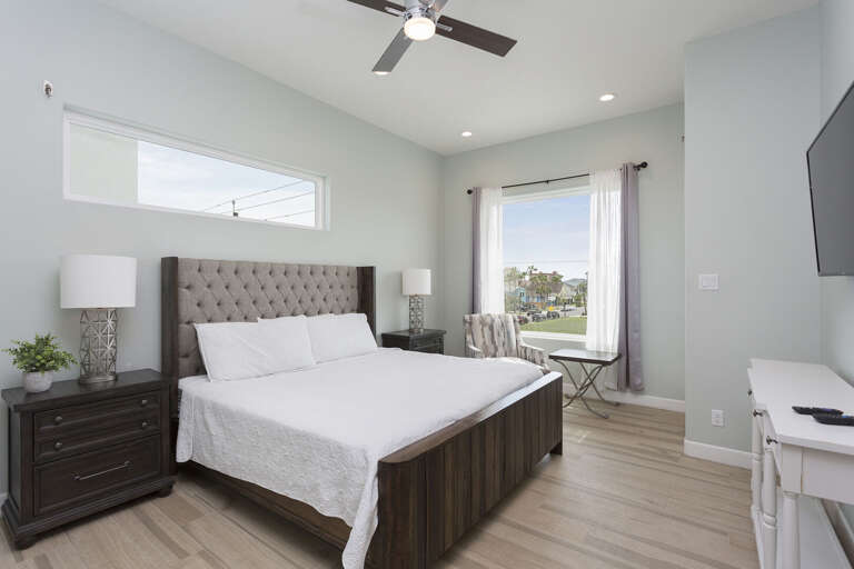 Second floor (street side) guest bedroom with a king bed and en-suite.