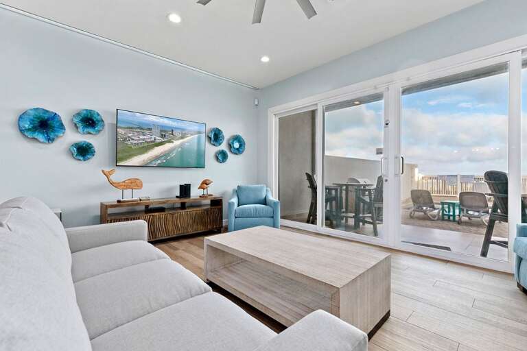 Living area with ample seating for guests to relax and enjoy the ocean views!