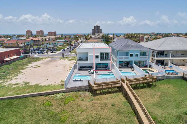 Aerial view of the back exterior and pool