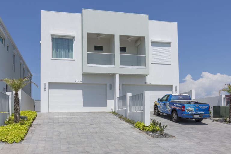 Driveway accommodates 4 compact vehicles. Additional parking on Gulf Blvd. (Garage is not available for guest use).