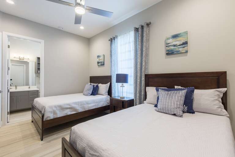 Second floor guest bedroom with full beds