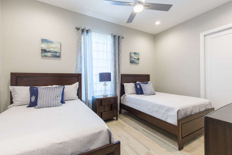 Second floor guest bedroom with full beds