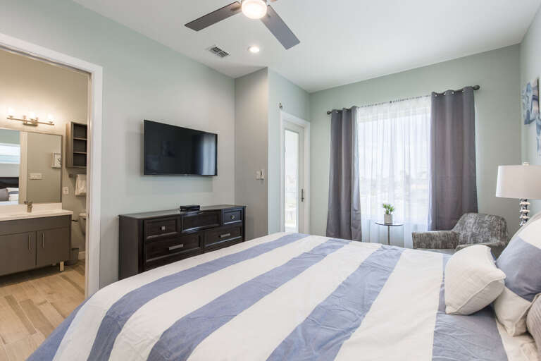 Second floor guest bedroom with queen bed