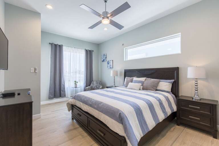 Second floor guest bedroom with queen bed