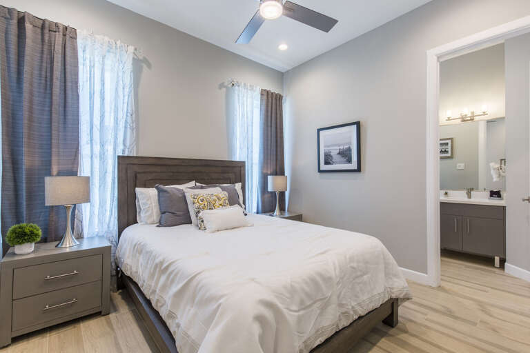 Second floor guest bedroom with a queen bed