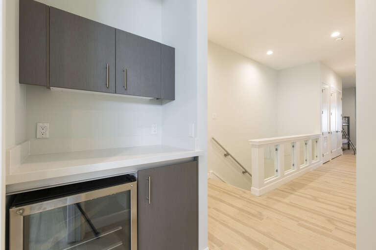 Second floor stairway and wet bar