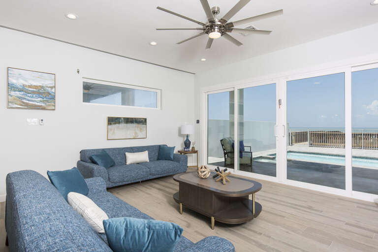Living area with  pool and beach view