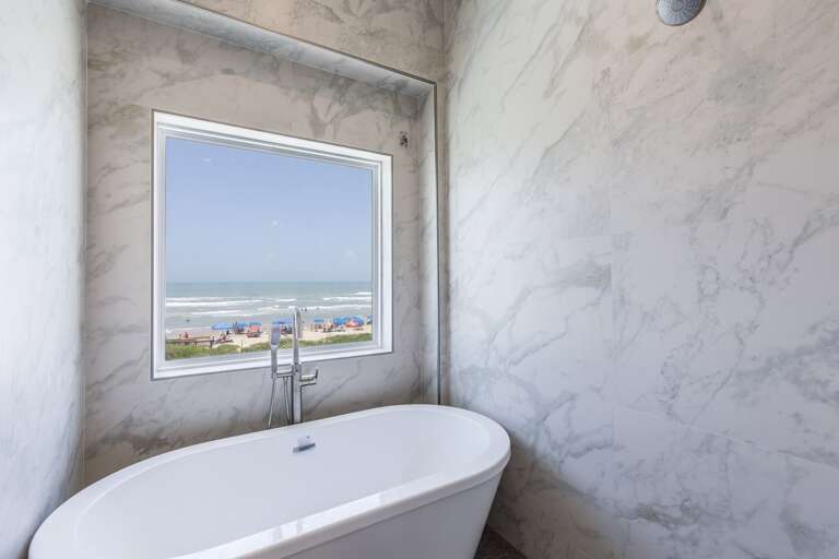 Master en-suite bathroom with walk-in shower and soaking tub