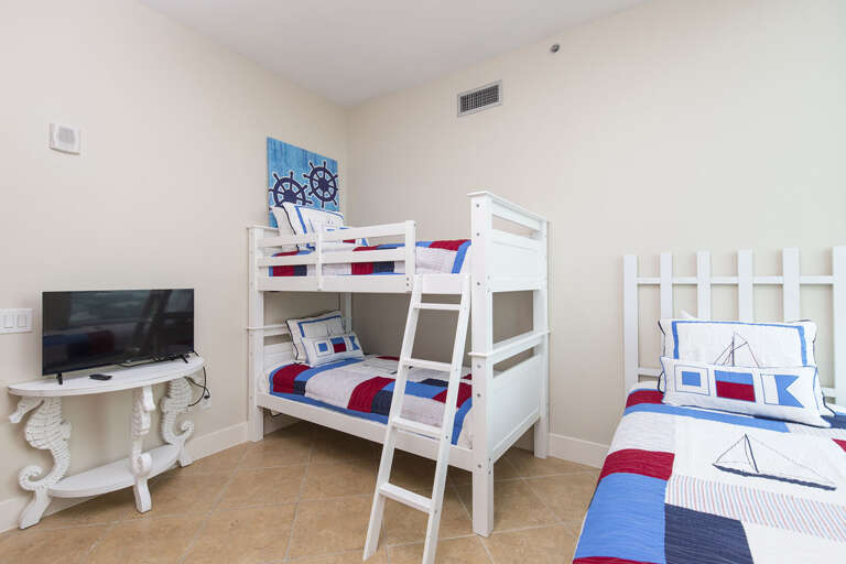 3rd guest room with a Twin bunk bed and a Twin single, sleeps 3 total. Flat screen TV and vies of the water!