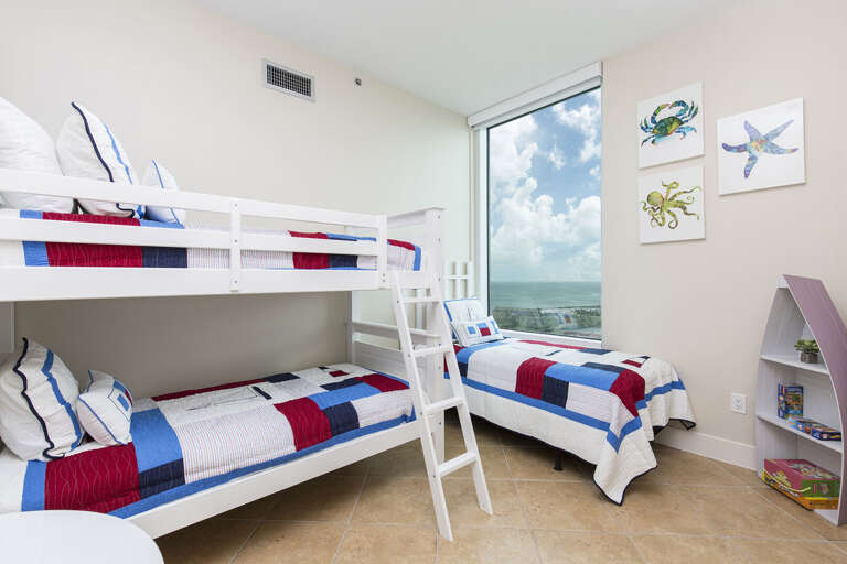3rd guest room with Twin bunk beds and a Twin single, sleeps 3 total. Beautiful views of the water!