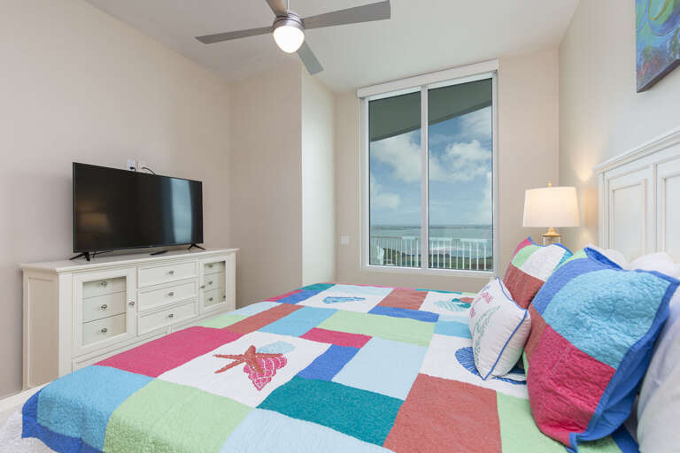 Master bedroom with flat screen TV and views of the Laguna Madre Bay!