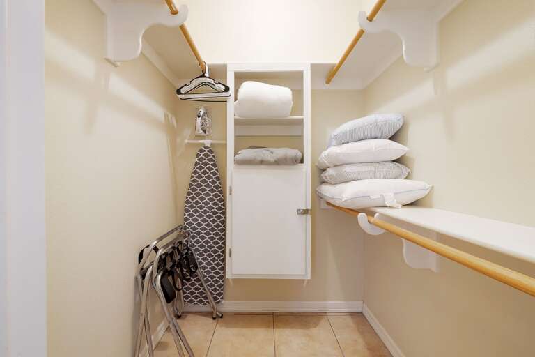 Walk in closet featured in master bedroom.