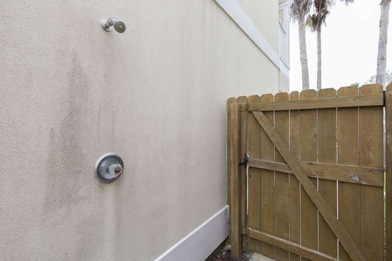 Outside to wash away the beach!