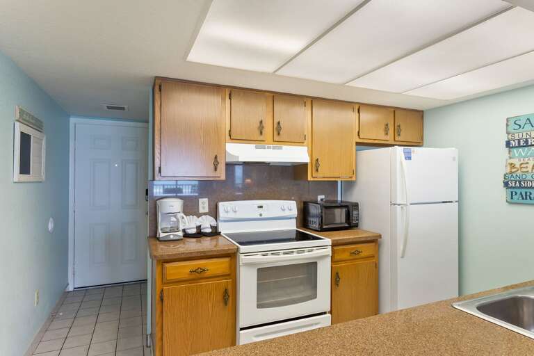 Fully Equipped kitchen area provides all your essentials needed to cook your favorite meals!