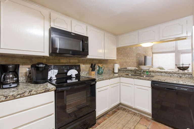 Fully Stocked Kitchen with supplies essential to prepare a home cooked meal
