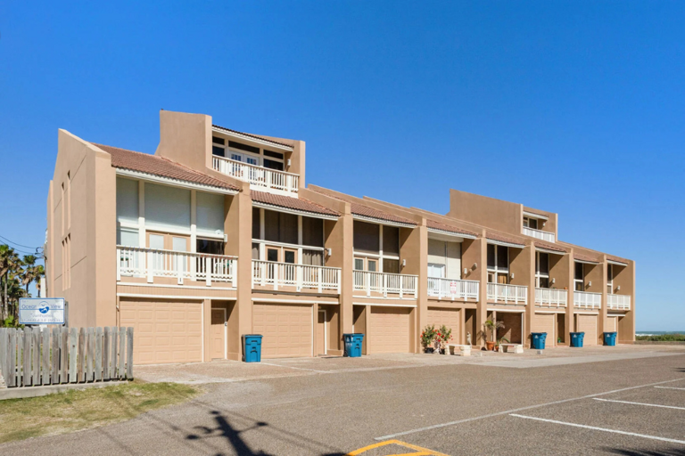 Just steps from the beach, this spacious three-story townhome is the perfect home base for your South Padre Island getaway.