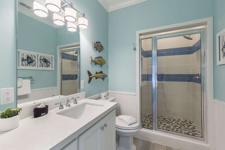 Guest bathroom features walk in shower.