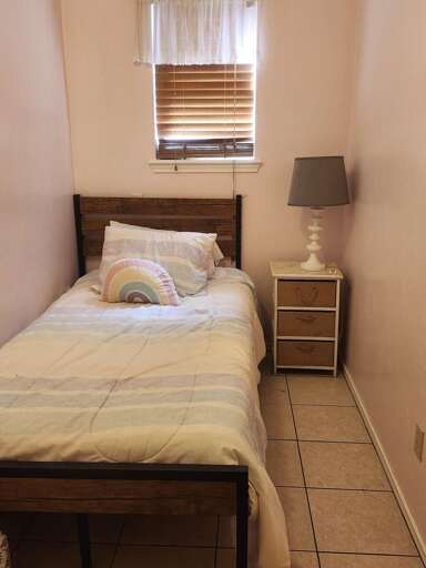 Bedroom 4 includes a twin bed and is accessible only through the master bedroom, offering a cozy space for an additional guest. Bedroom 4 includes a twin bed and is accessible only through the master bedroom, offering a cozy space for an additional guest.