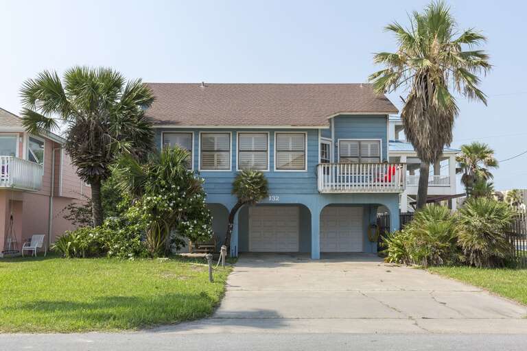 Front exterior to your private home just steps away form the beach!