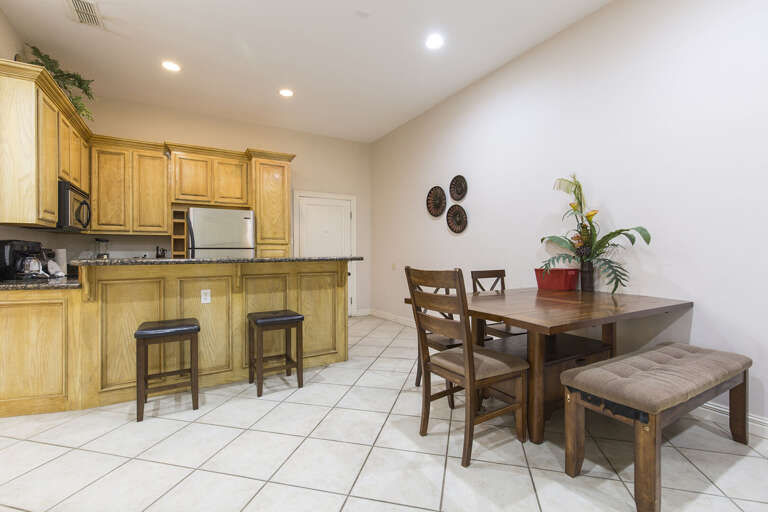 Kitchen With Dining Area And Tiled Floor