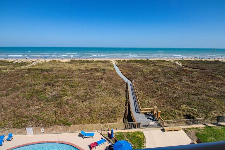 Pathway To Sandy Shore, Shimmering Sea, Poolside Below