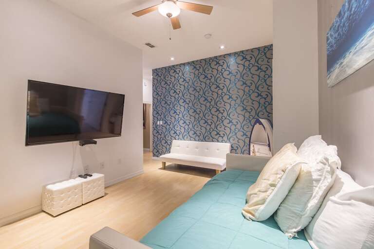 Guest Room with 4 twins (2 trundles). This is an open concept room/media room that is included in the total number of bedrooms.