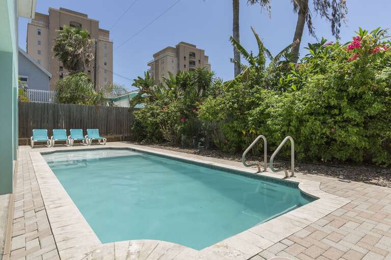 Your private South Padre Island retreat featuring a heated pool and just a short walk to the beach.