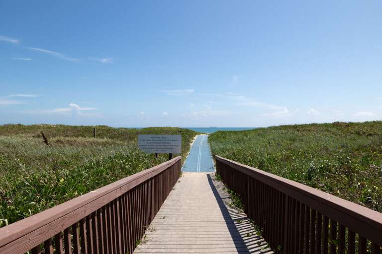 A convenient beachfront walkway leads you through the dunes and straight toward the Gulf.