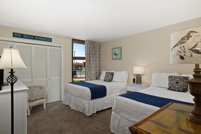 Two full beds provide plenty of room for family or friends in the guest room.