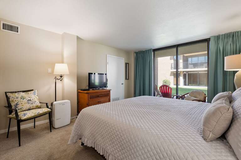 Master bedroom with a flat screen TV