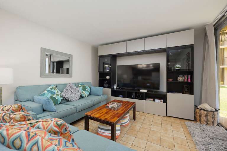 Spacious newly renovated living area featuring a large flat screen TV!