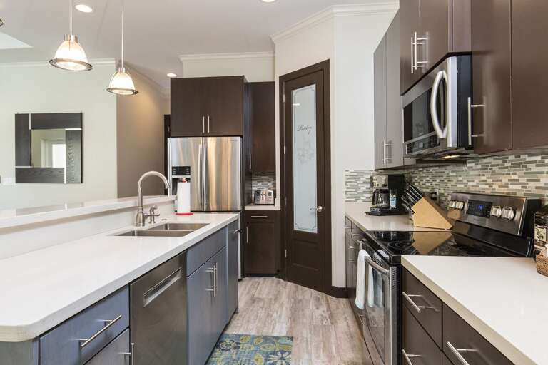 Fully stocked kitchen with all pots, pans, and cooking utensils!