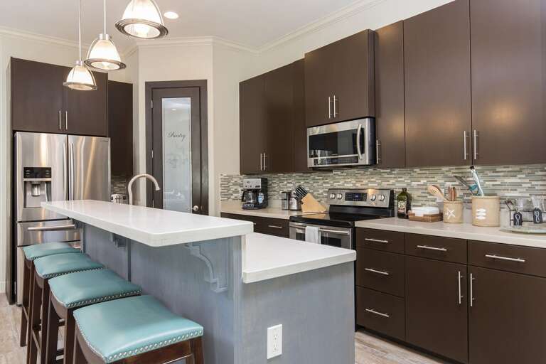 Fully stocked kitchen with all pots, pans, and cooking utensils!