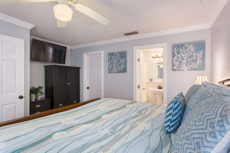 2nd Master Bedroom (ground floor) with King size bed, flat screen TV and private bathroom. This room also has a private access to the pool. (Ground Floor)