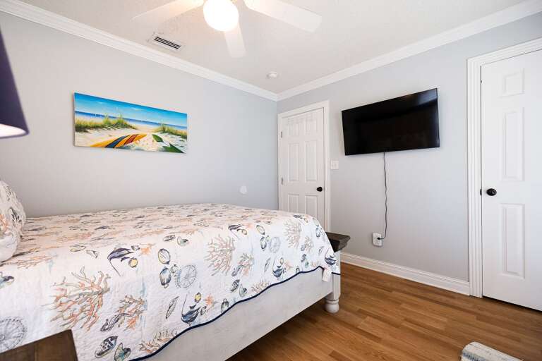 3rd Bedroom located on the 3rd floor with a Queen bed and access to the 3rd floor balcony.