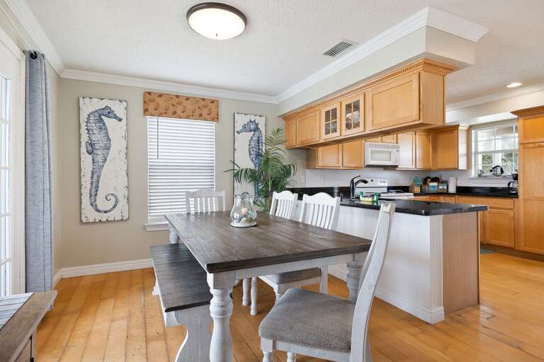 Dining area and kitchen is semi open to the kitchen and located off the living room.