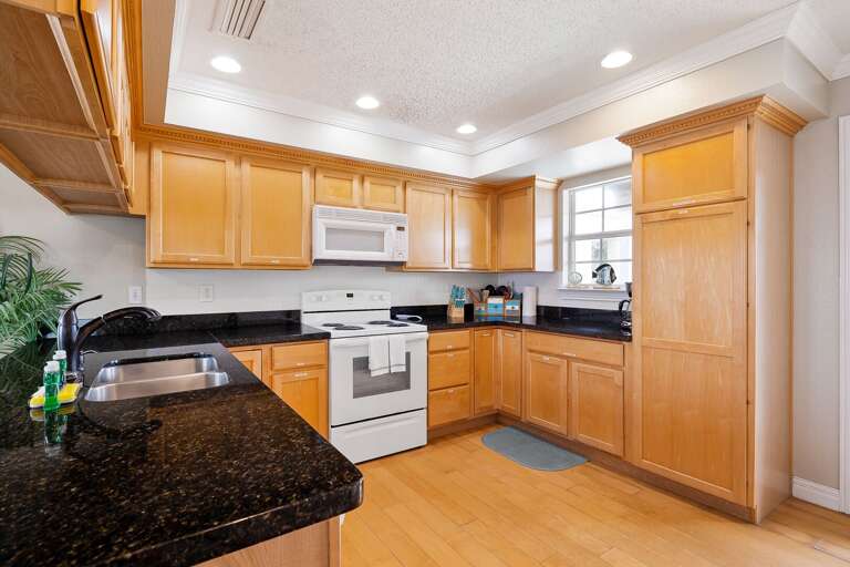 Kitchen is fully stocked with pots, pans, dishwater, glassware &  utensils. (2nd Floor)