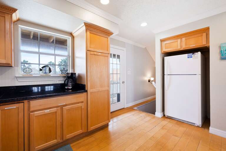 Kitchen is fully stocked with pots, pans, dishwater, glassware &  utensils. (2nd Floor)