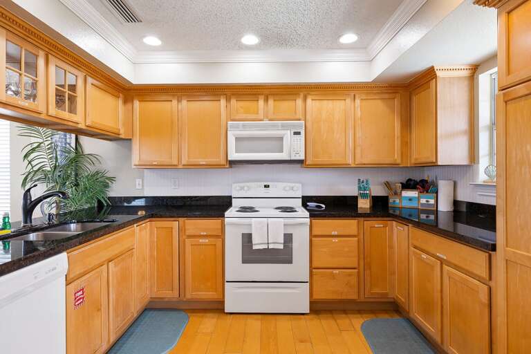 Kitchen is fully stocked with pots, pans, dishwater, glassware &  utensils. (2nd Floor)
