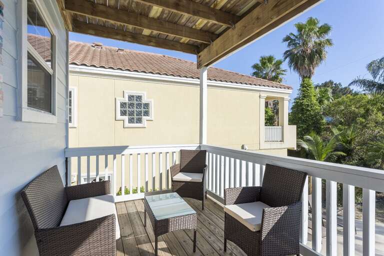 Outdoor seating on 2nd story balcony, overlooking the pool.